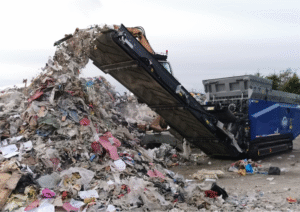 industrial shredder machine shredding municipal waste in BC